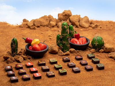 Chocolate pieces and peppers in a desert